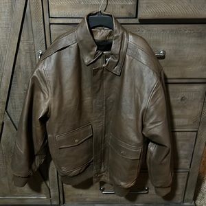 A brown leather jacket size 2xl